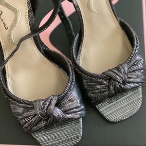 Antique silver shoes with 4” stiletto heel.